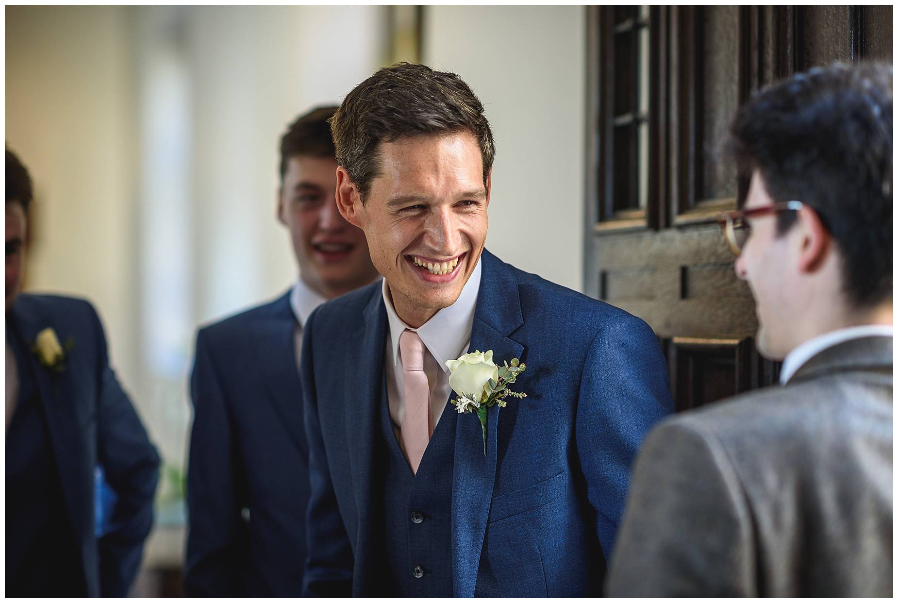 The groom laughing