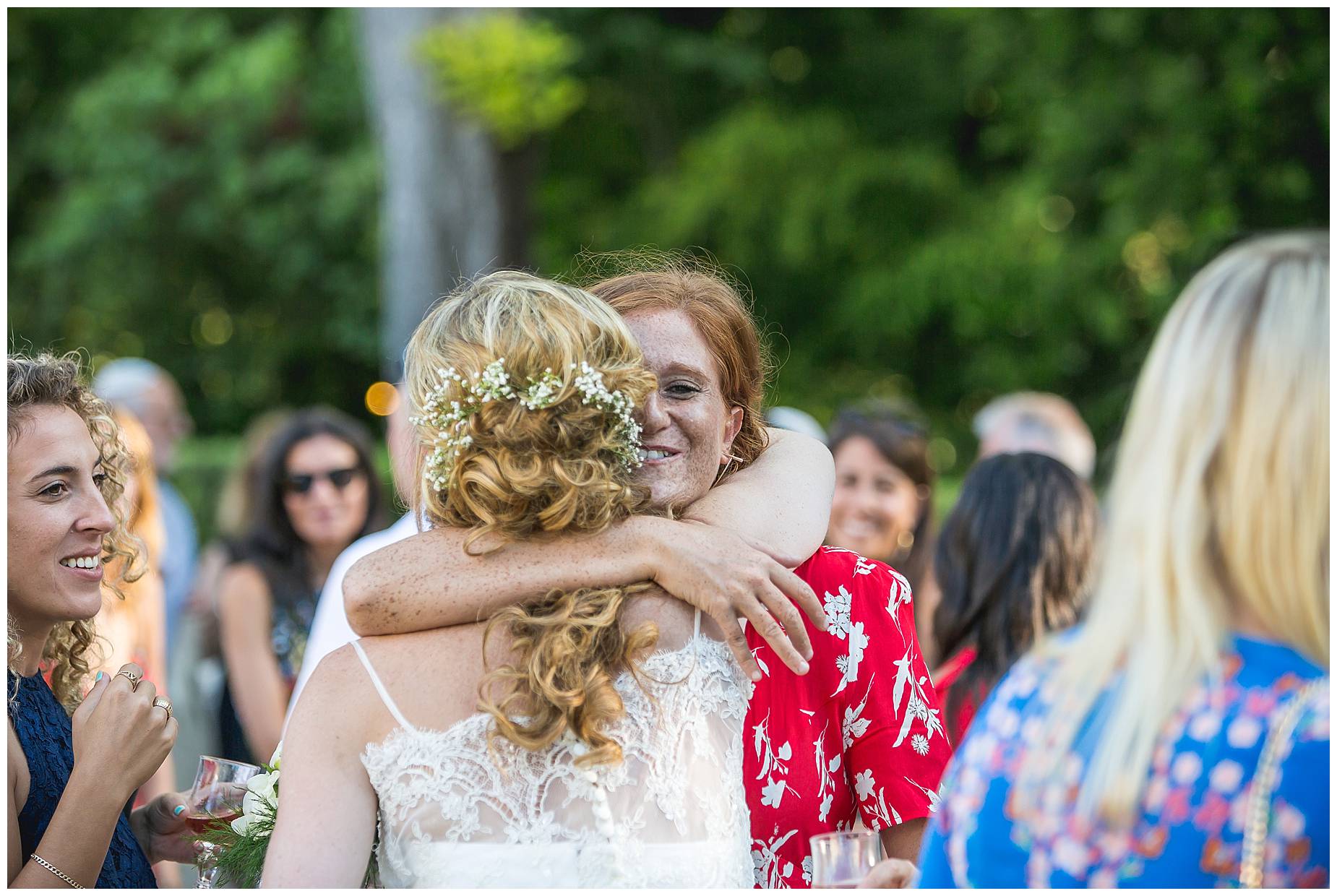 guest hugs bride
