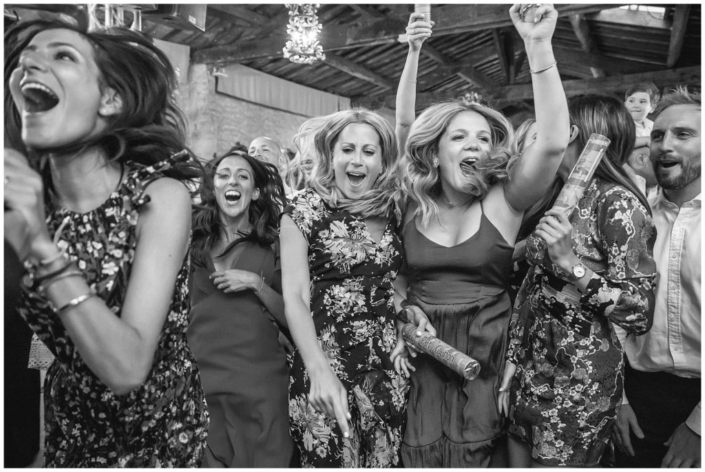 Guest dancing at a lively wedding at Château de Pouget near Montpellier