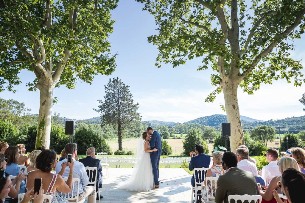 Newlyweds kissing after their Château de Malmont wedding