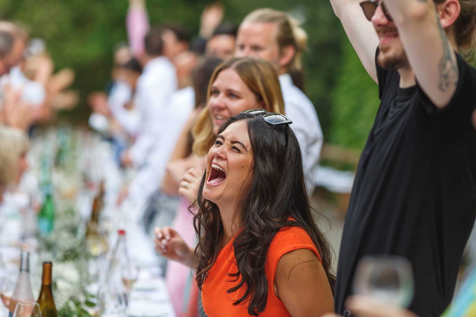 Wedding guest laughing during the reception at Domaine Saint Hilaire