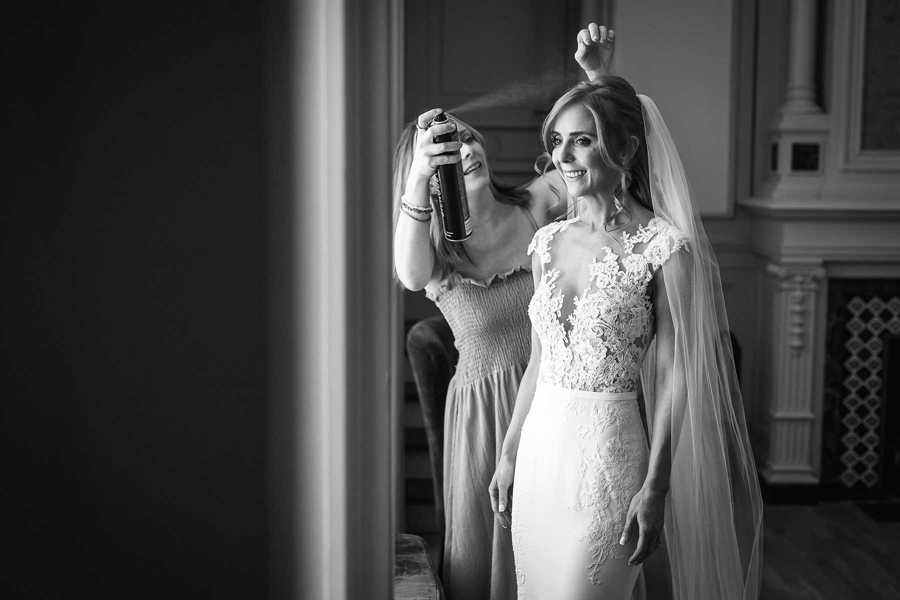 Bride smiling as her hair is finished before a wedding in the South of France