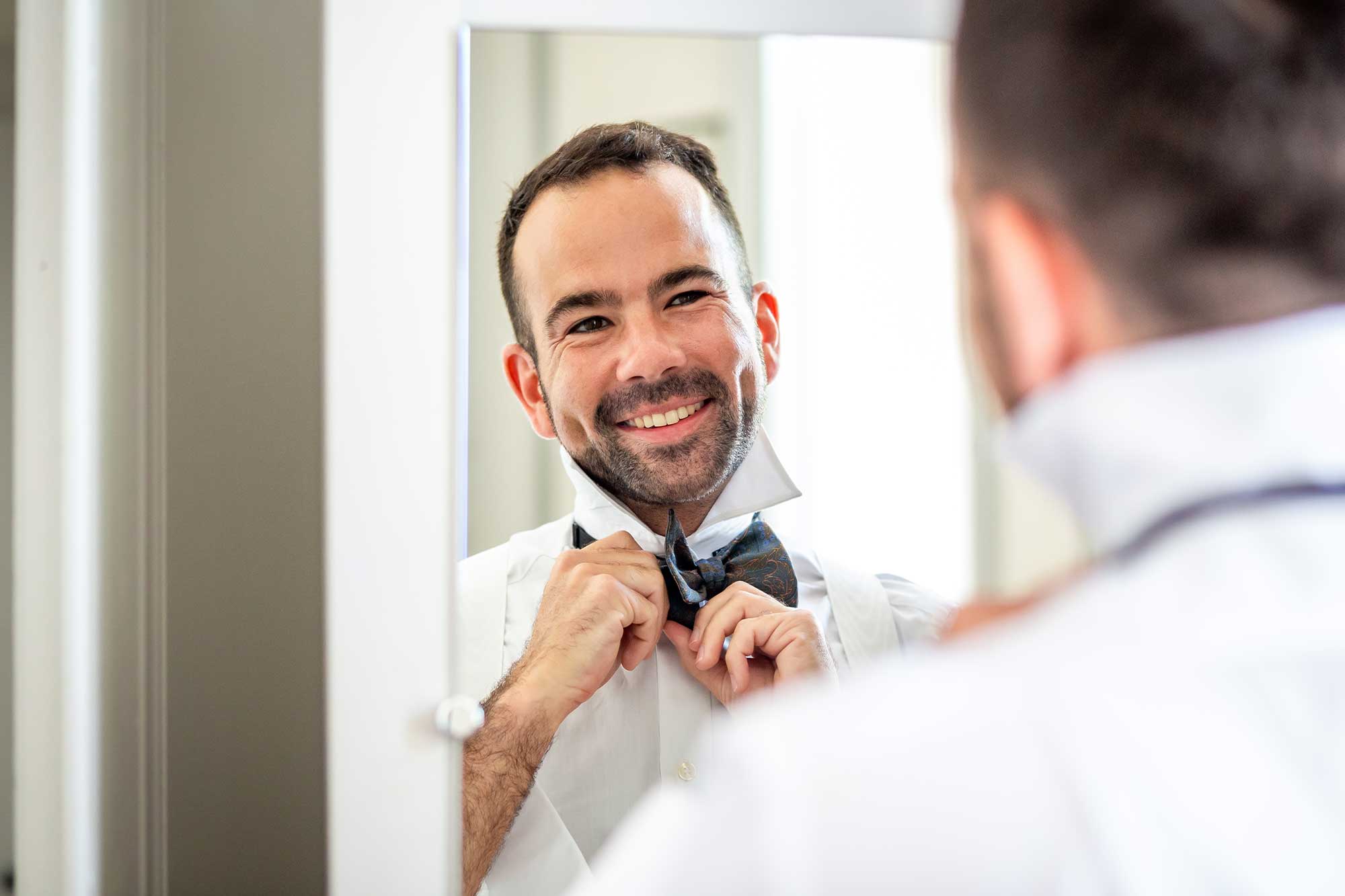 groom gets ready for Chateau Carrasses vineyard wedding 