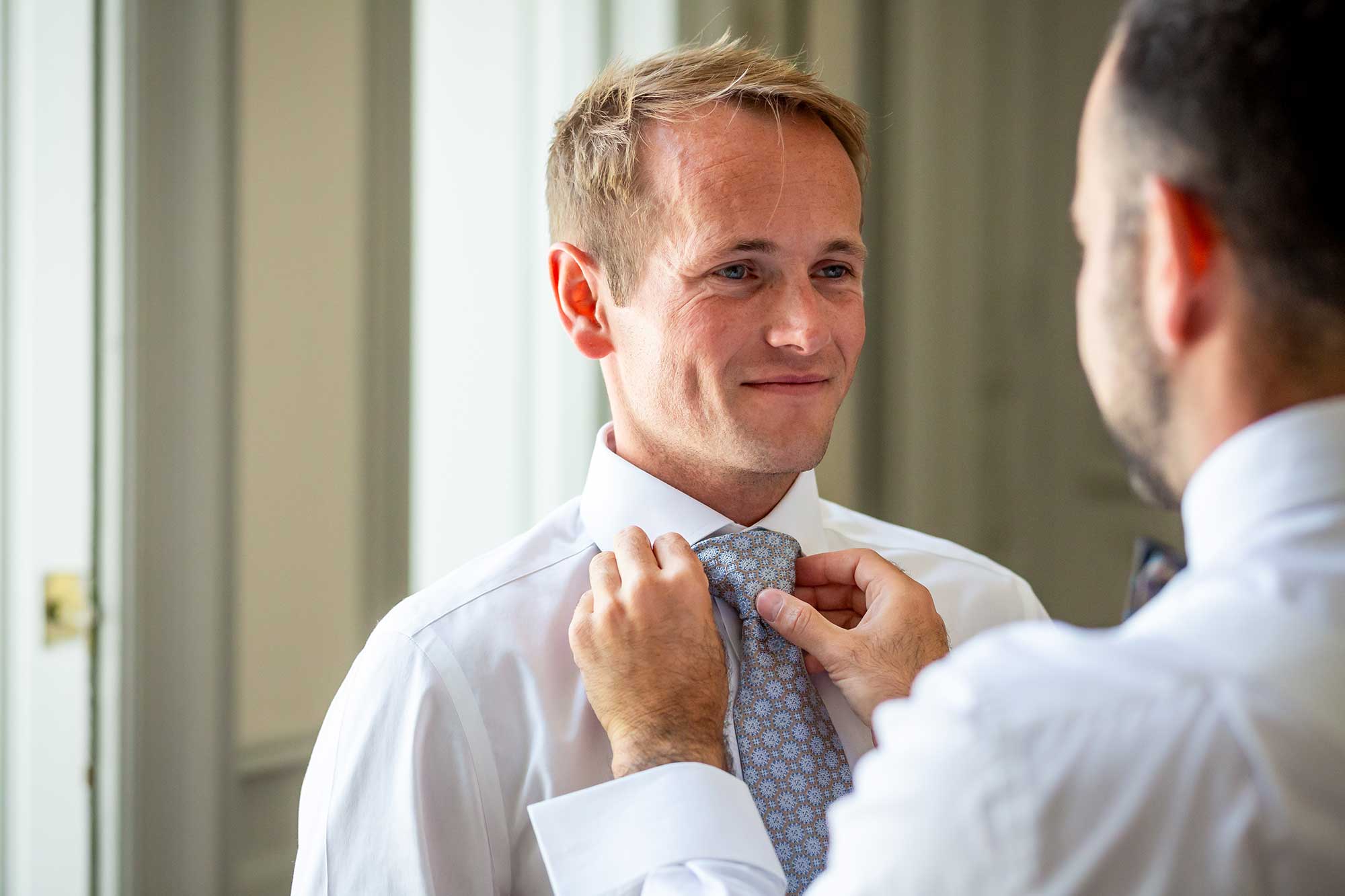 another groom gets ready for his Chateau Carrasses vineyard wedding 