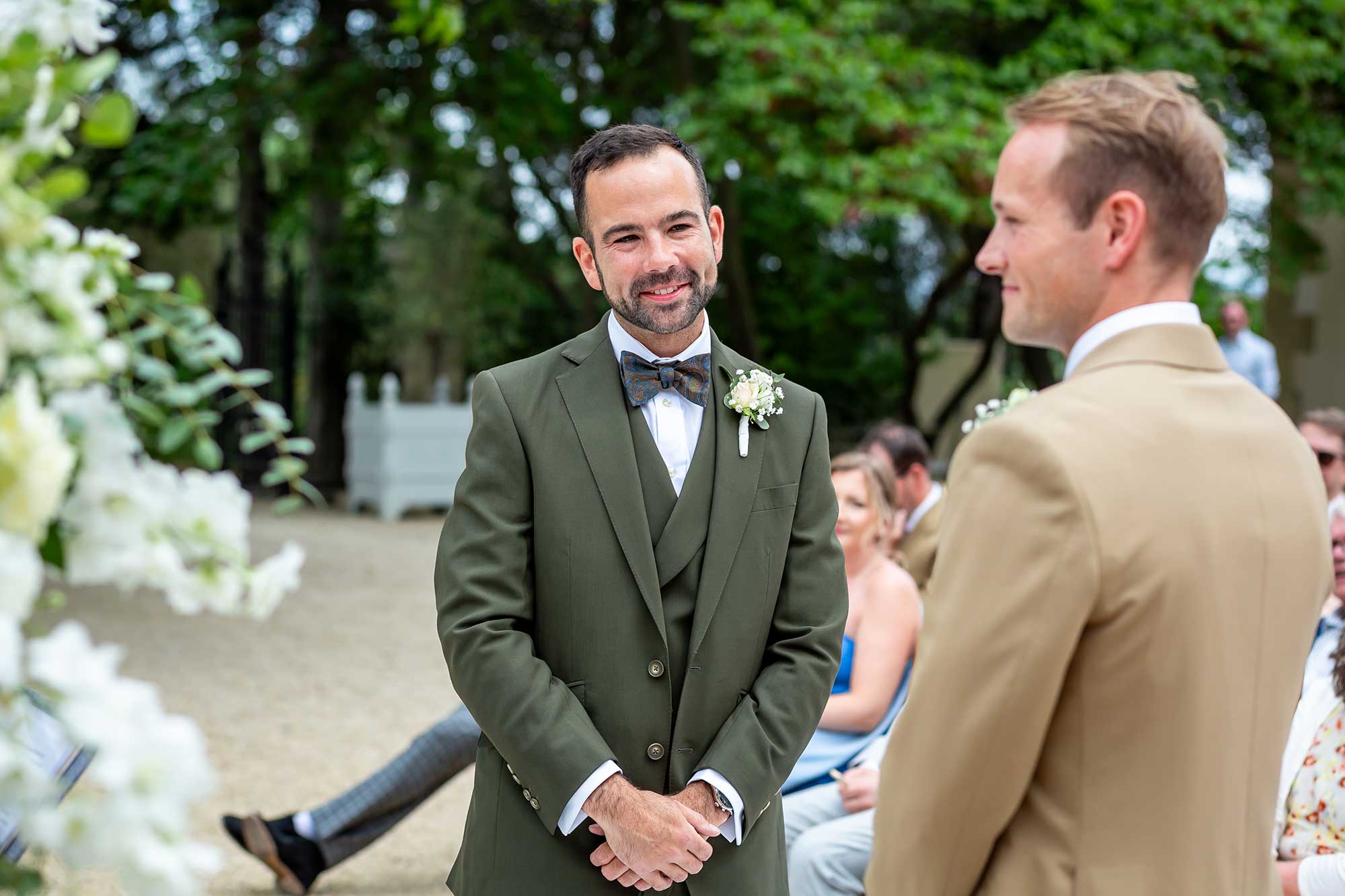 Chateau Carrasses vineyard wedding groom smiling at the other groom