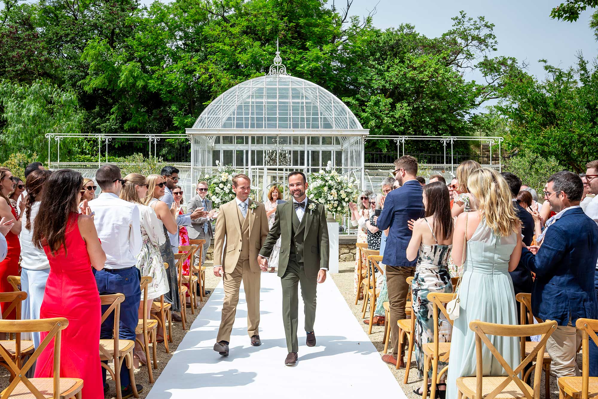Grooms walk back down the aisle at Chateau Carrasses vineyard wedding 