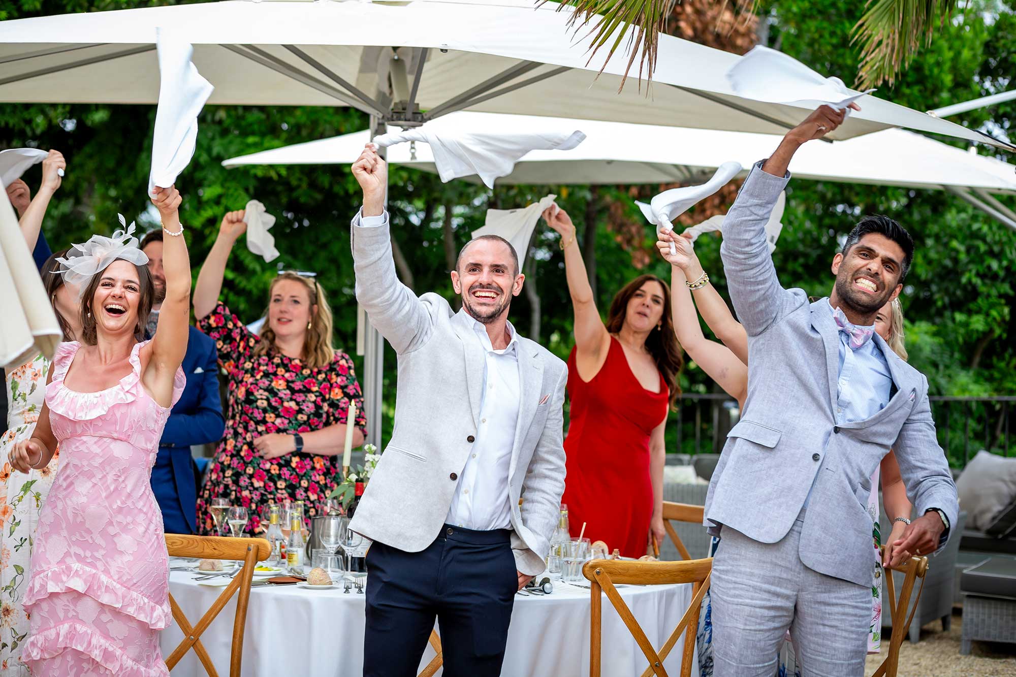 guests wave napkins at Chateau Carrasses vineyard wedding