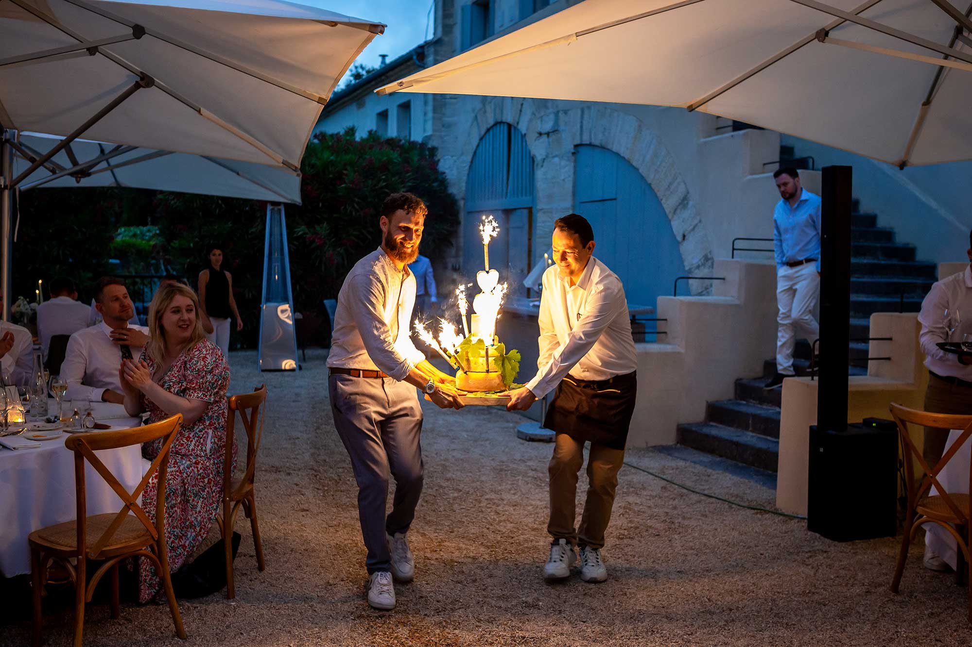 cake of cheese lit up by fireworks