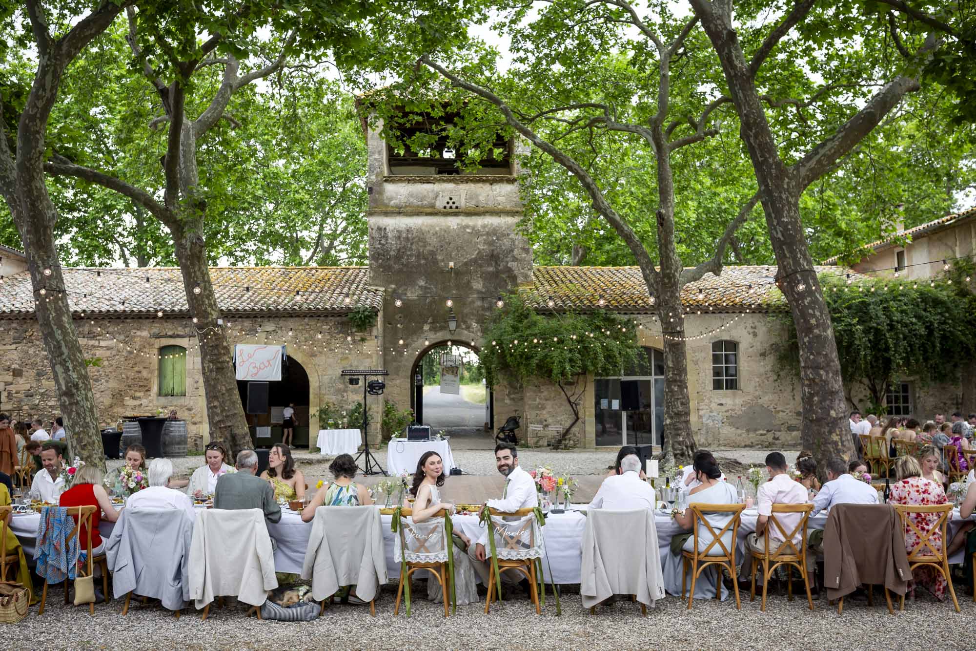 Outdoor wedding dinner in the courtyard at Seigneurie de Peyrat in southern France