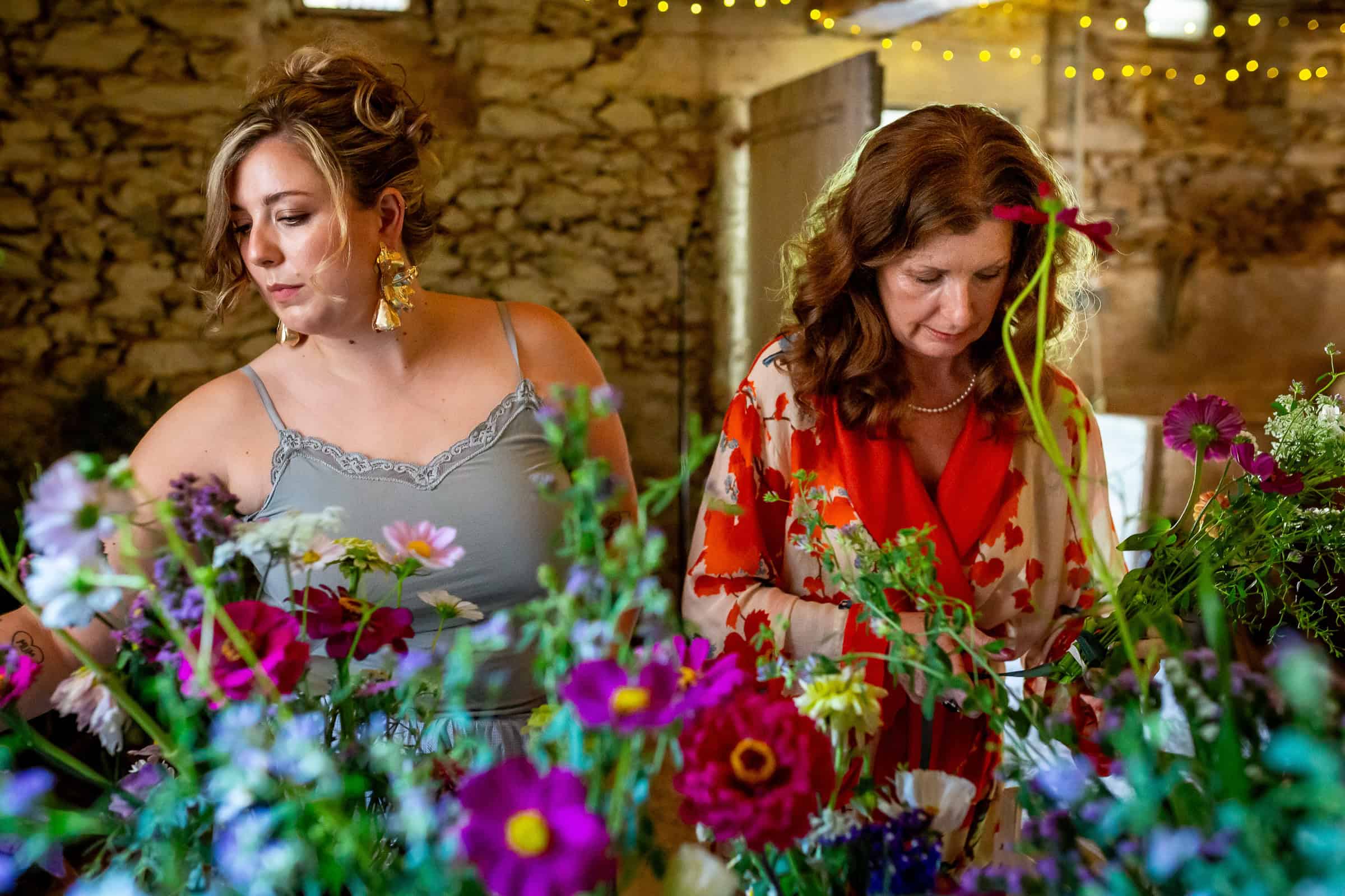 Family and friends arranging loose flowers for the wedding