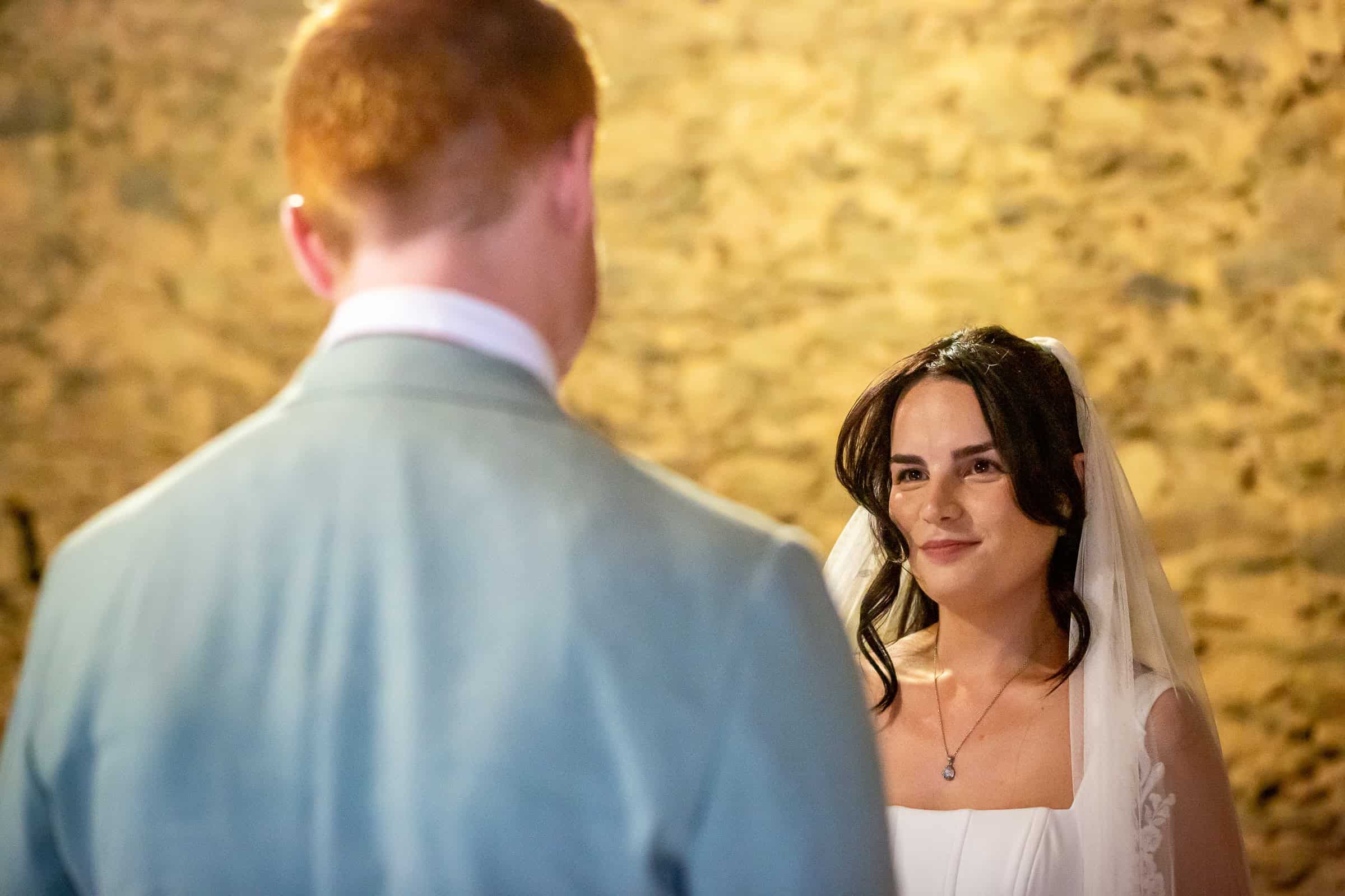 Kayley looking at Alexander during their barn ceremony