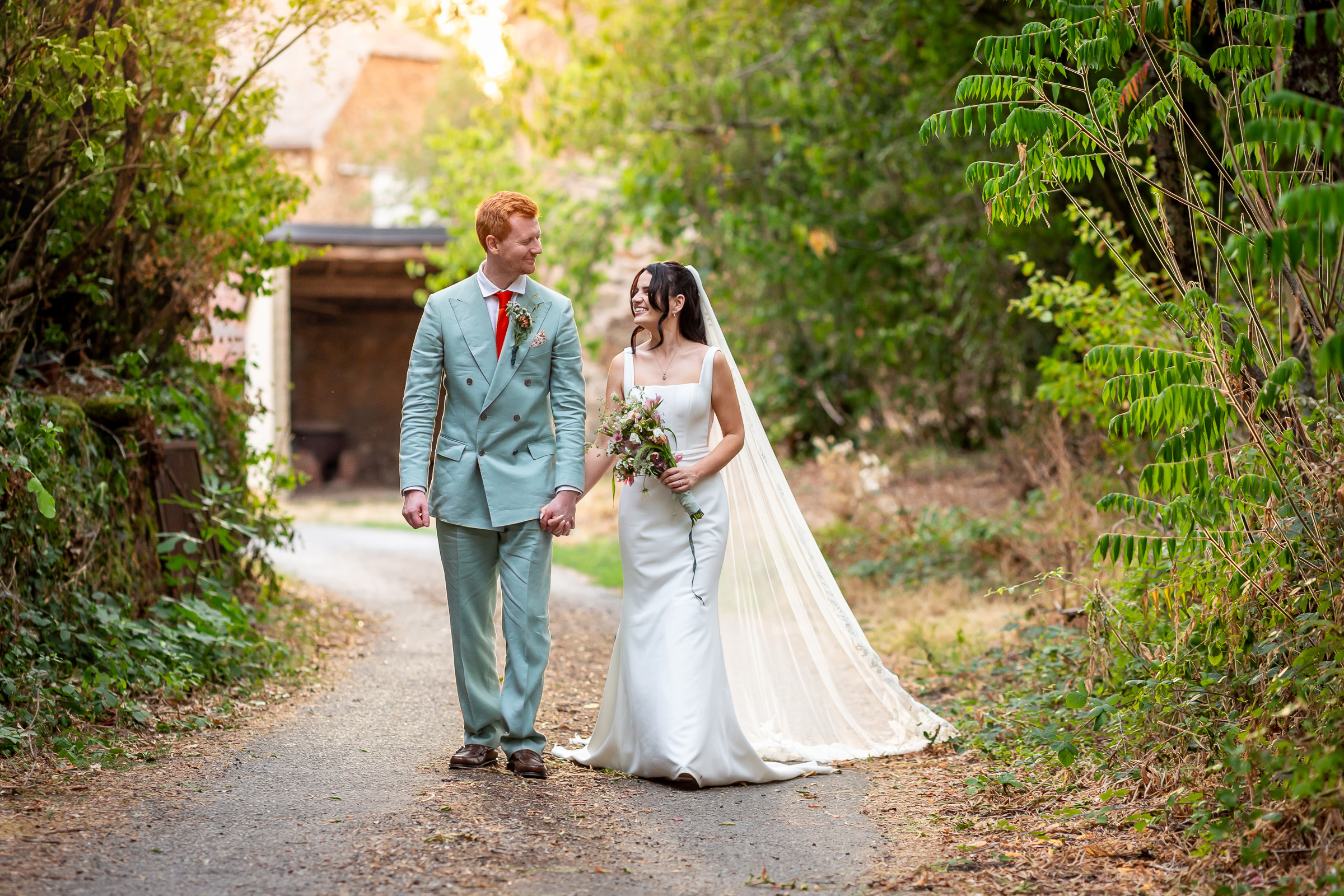 Kayley and Alexander walking together during their short portrait session