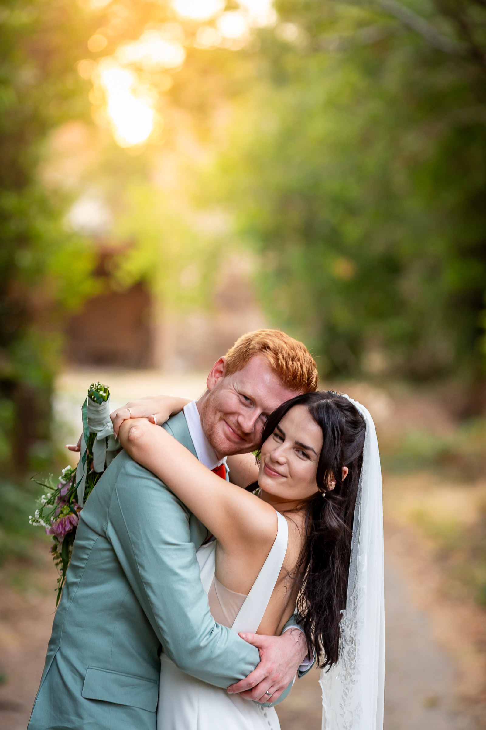Kayley and Alexander embracing during golden hour