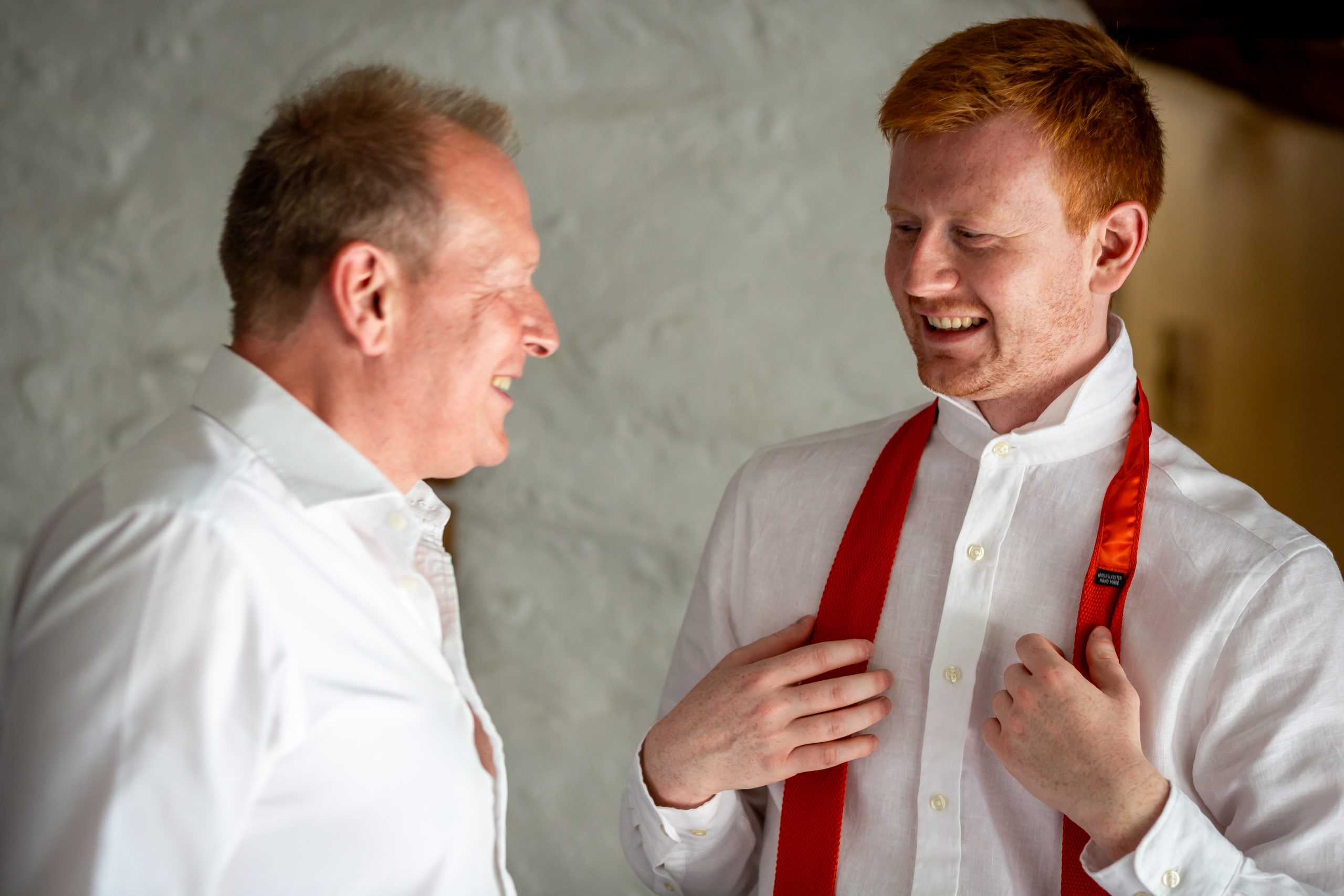 Alexander laughing with his dad while getting ready