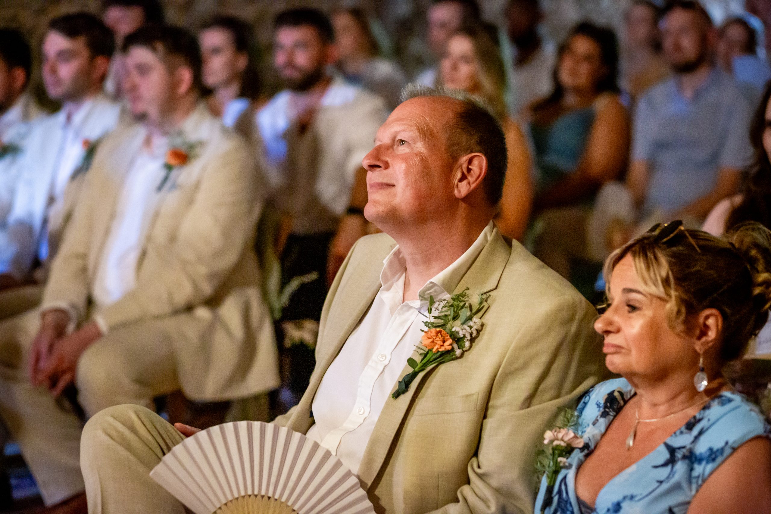 A wedding guest becoming emotional during the barn ceremony