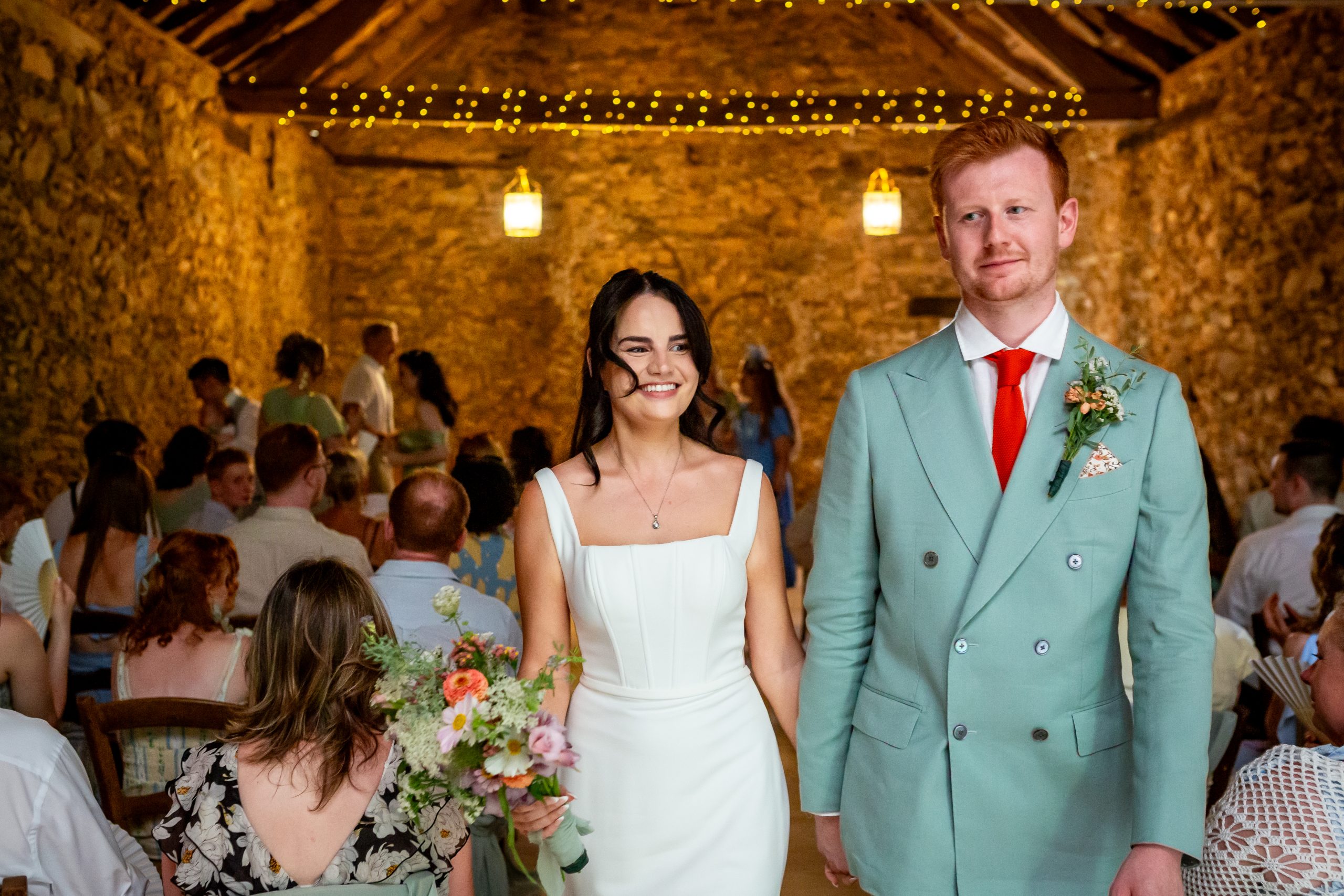 Kayley and Alexander walking back down the aisle after their barn ceremony