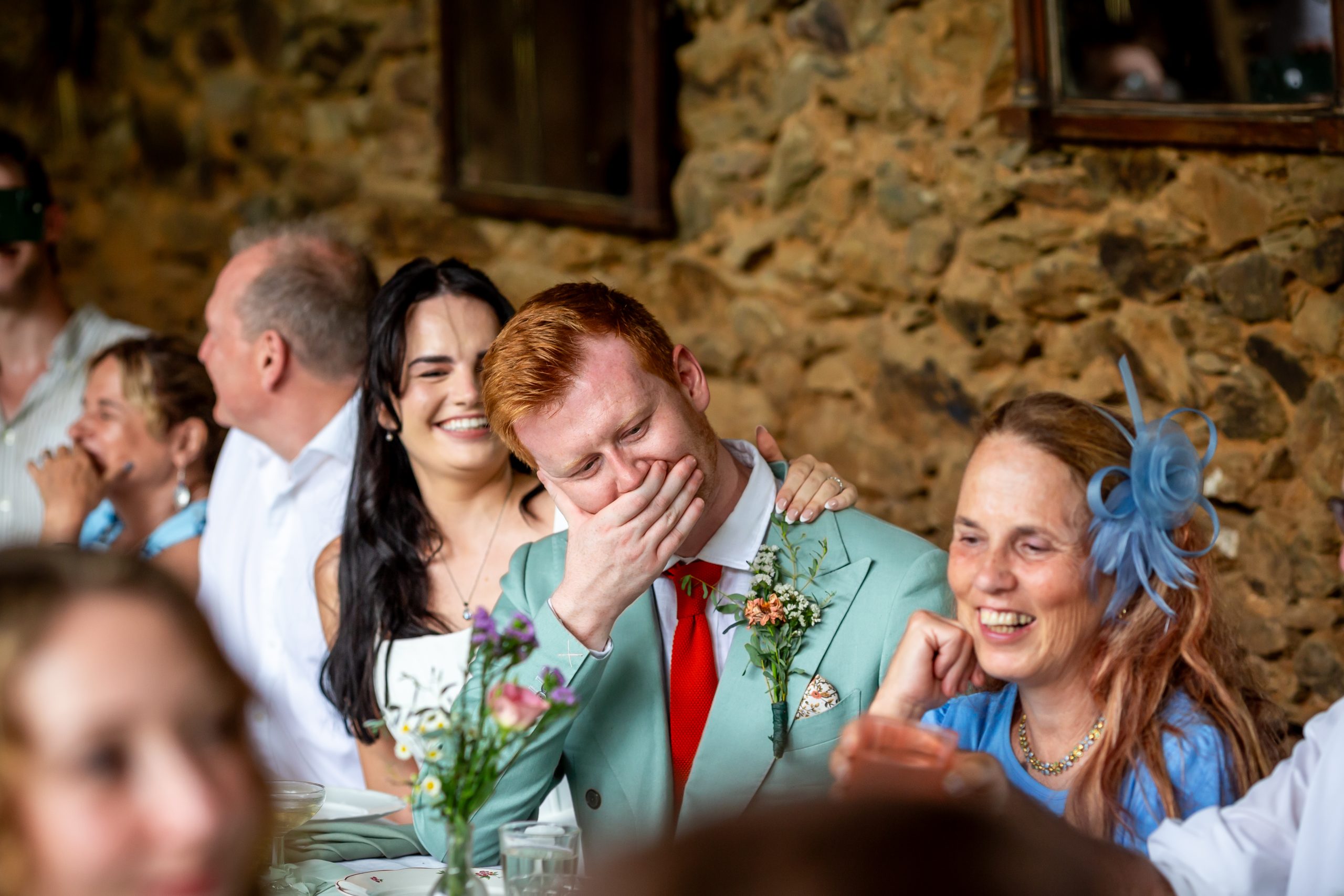 Kayley and Alexander sharing a private reaction during the speeches