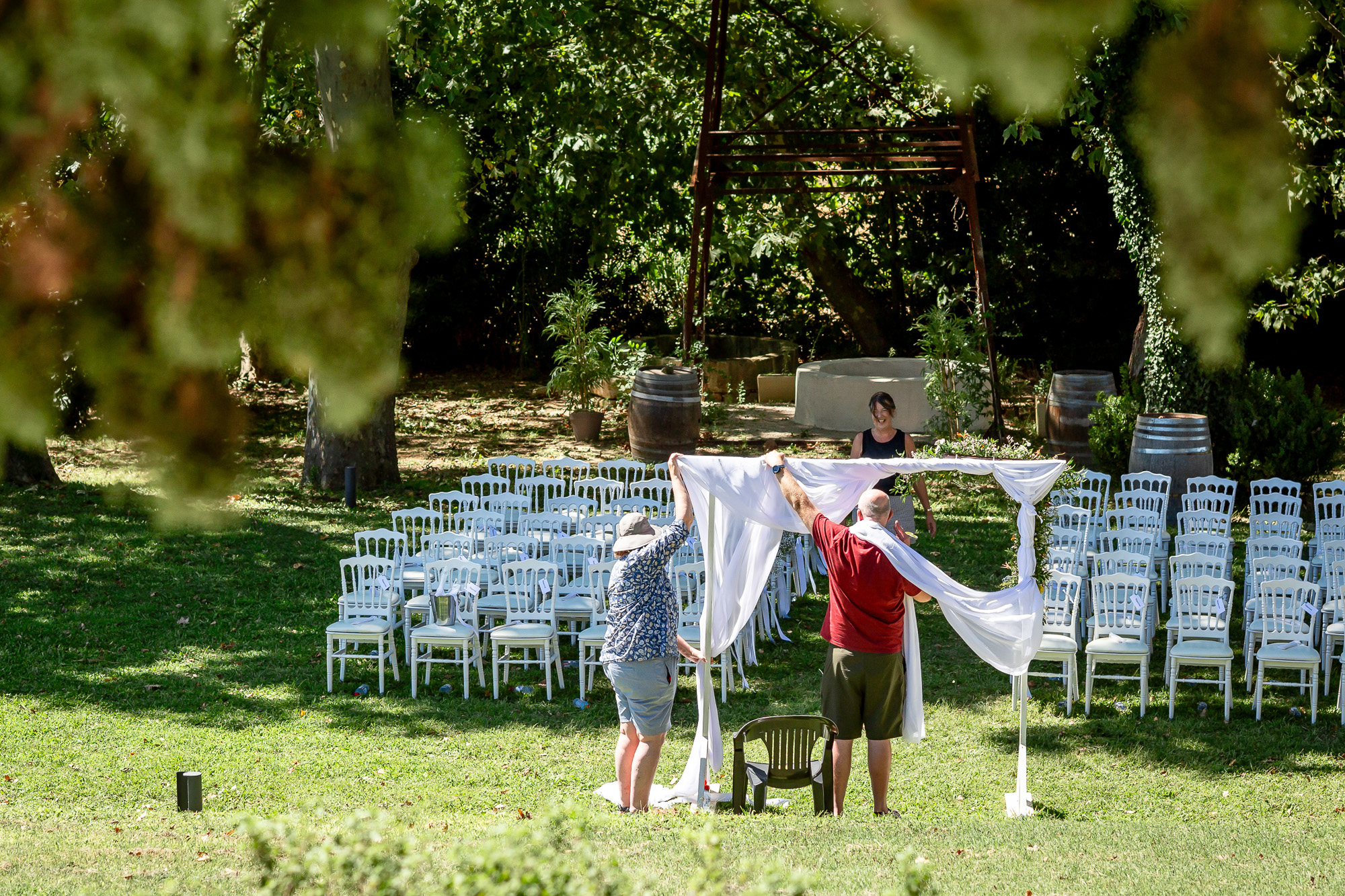 Hannah’s family decorating the outdoor ceremony at Château Bellefontaine