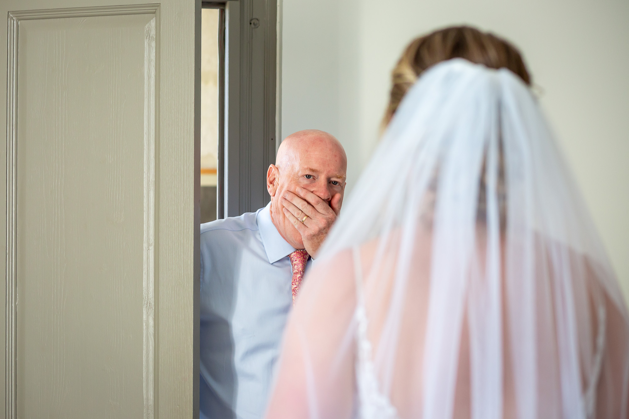 Hannah’s father seeing her in her wedding dress for the first time