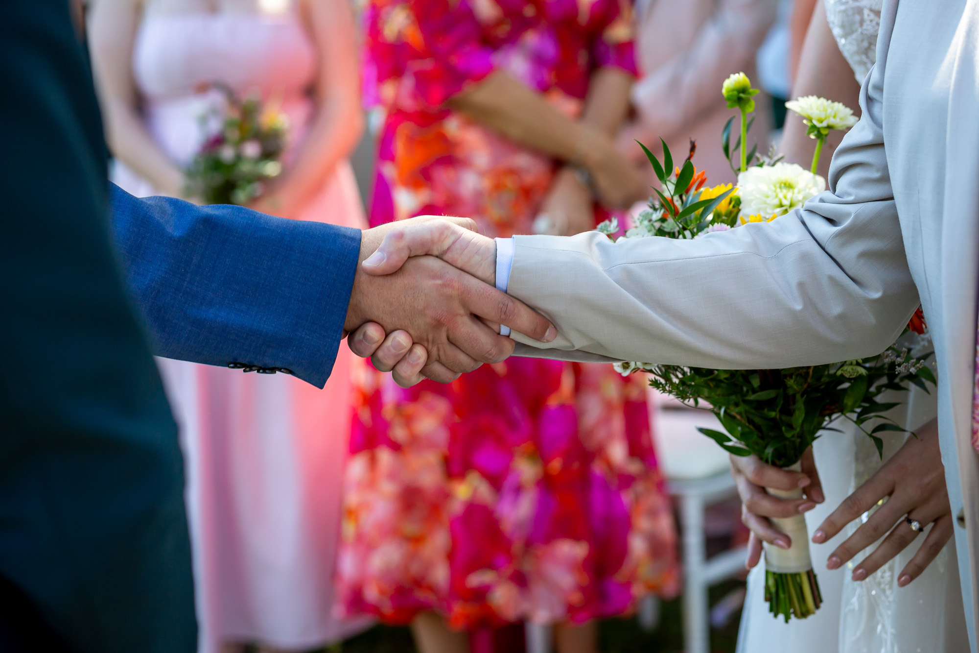 Thomas shaking hands with Hannah’s father as she reaches the ceremony