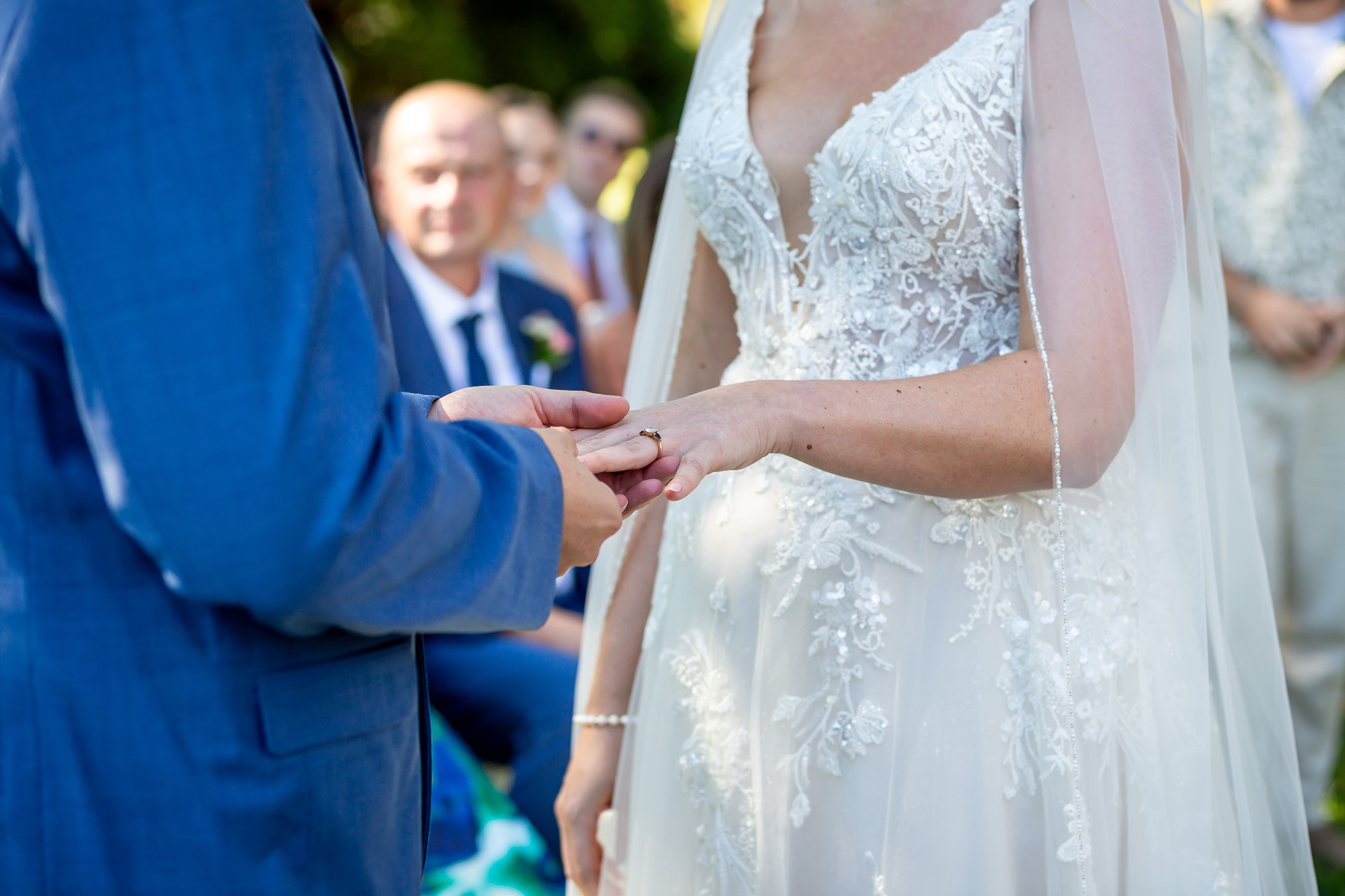 Hannah and Thomas exchanging wedding rings