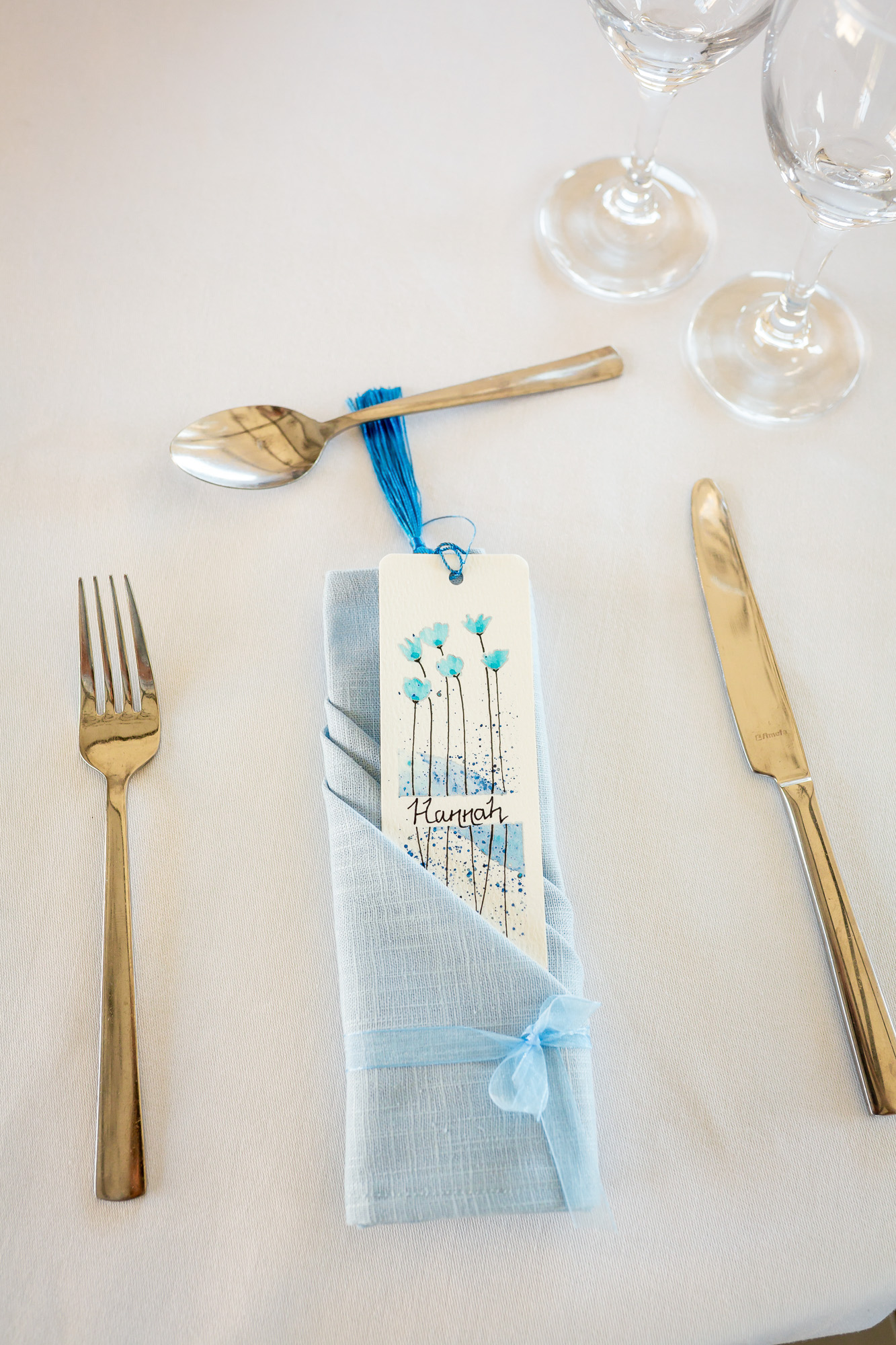 Handmade napkin and personalised place name at the wedding breakfast