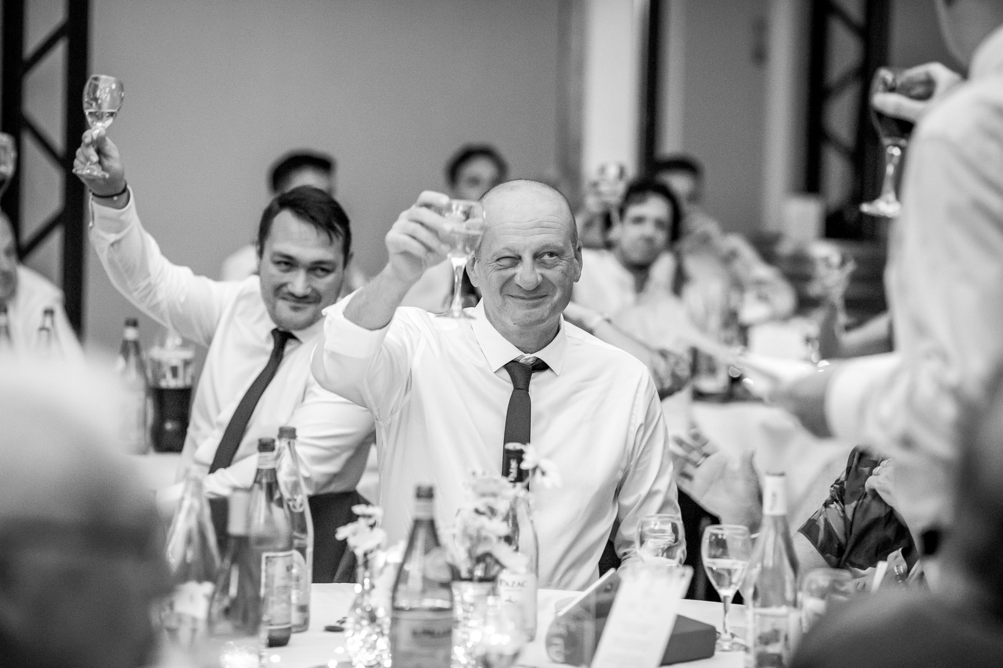 Thomas’s father raising his glass and giving him a cheeky wink