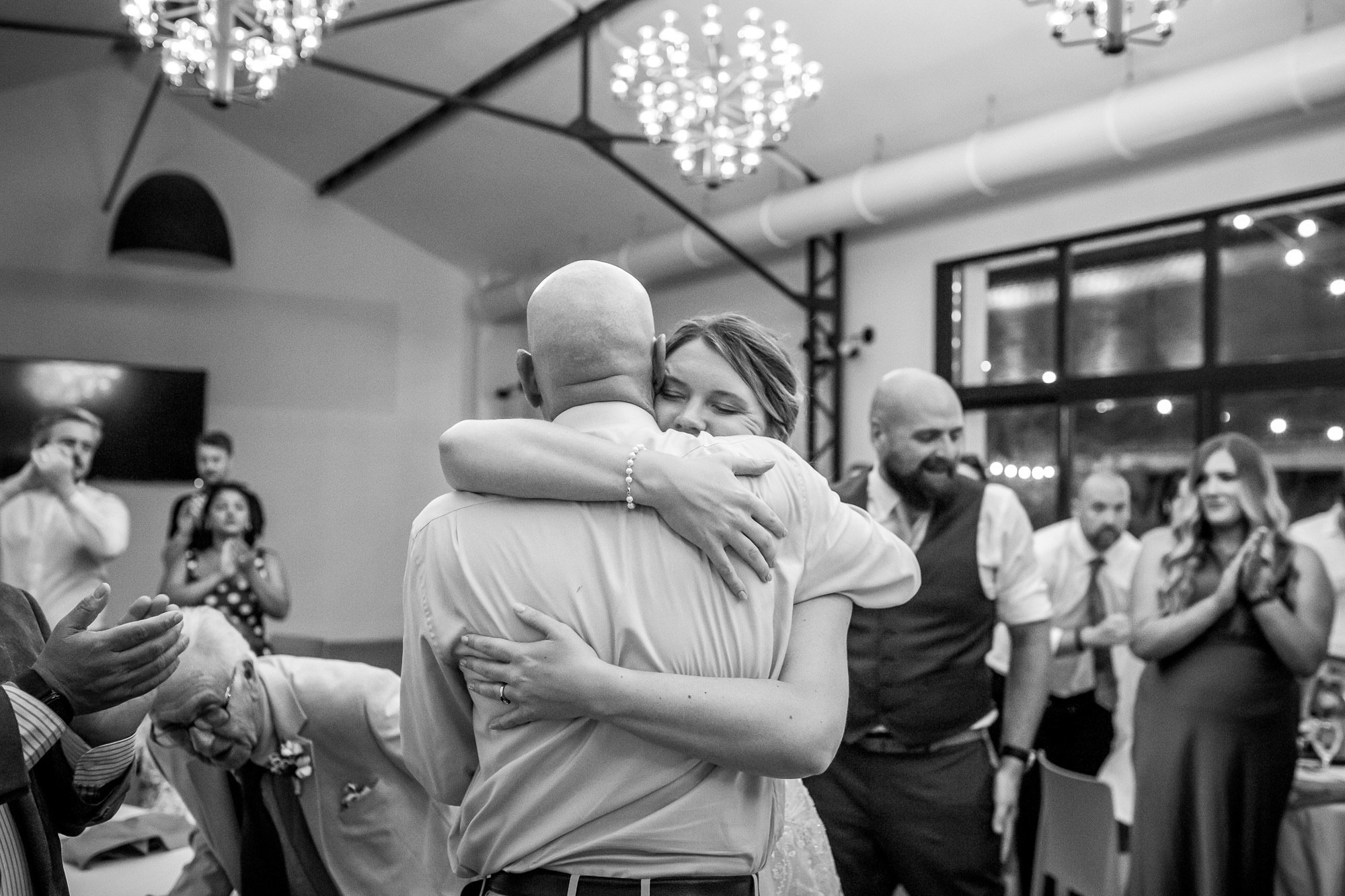 Hannah giving her father a huge hug after his wedding speech