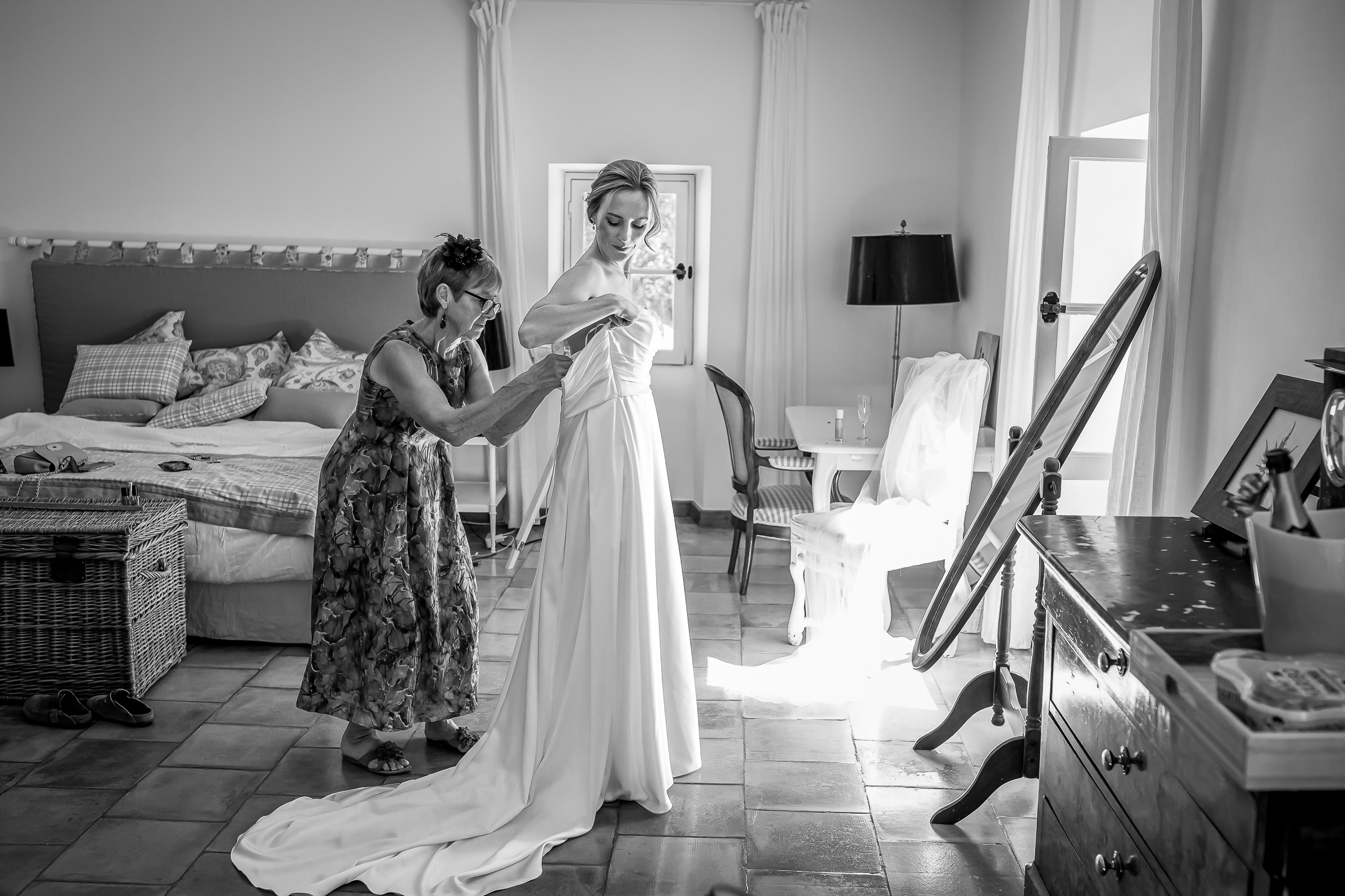 Emma being helped into her Pronovias wedding dress