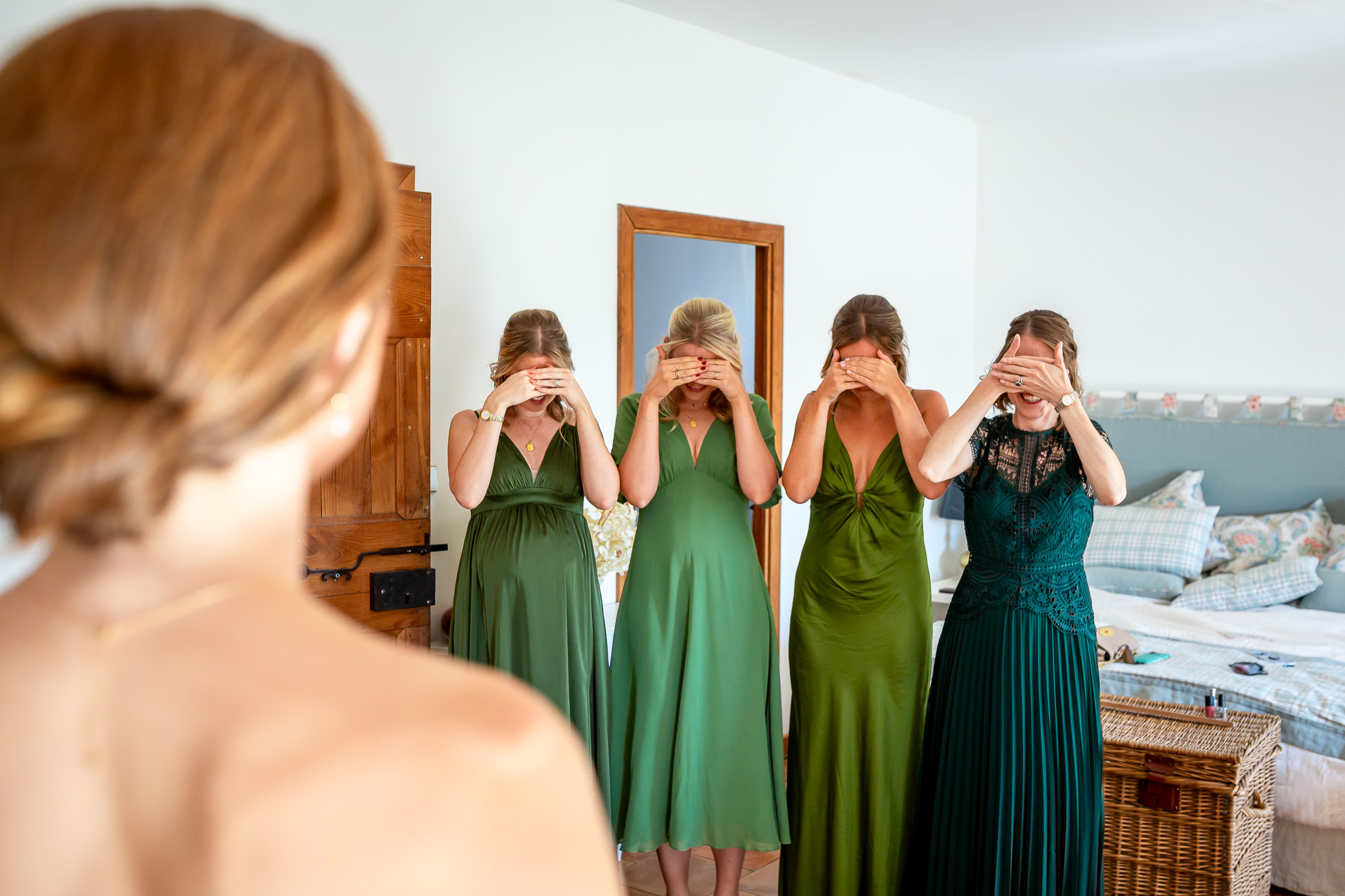 Emma’s bridesmaids reacting as they see her in her wedding dress