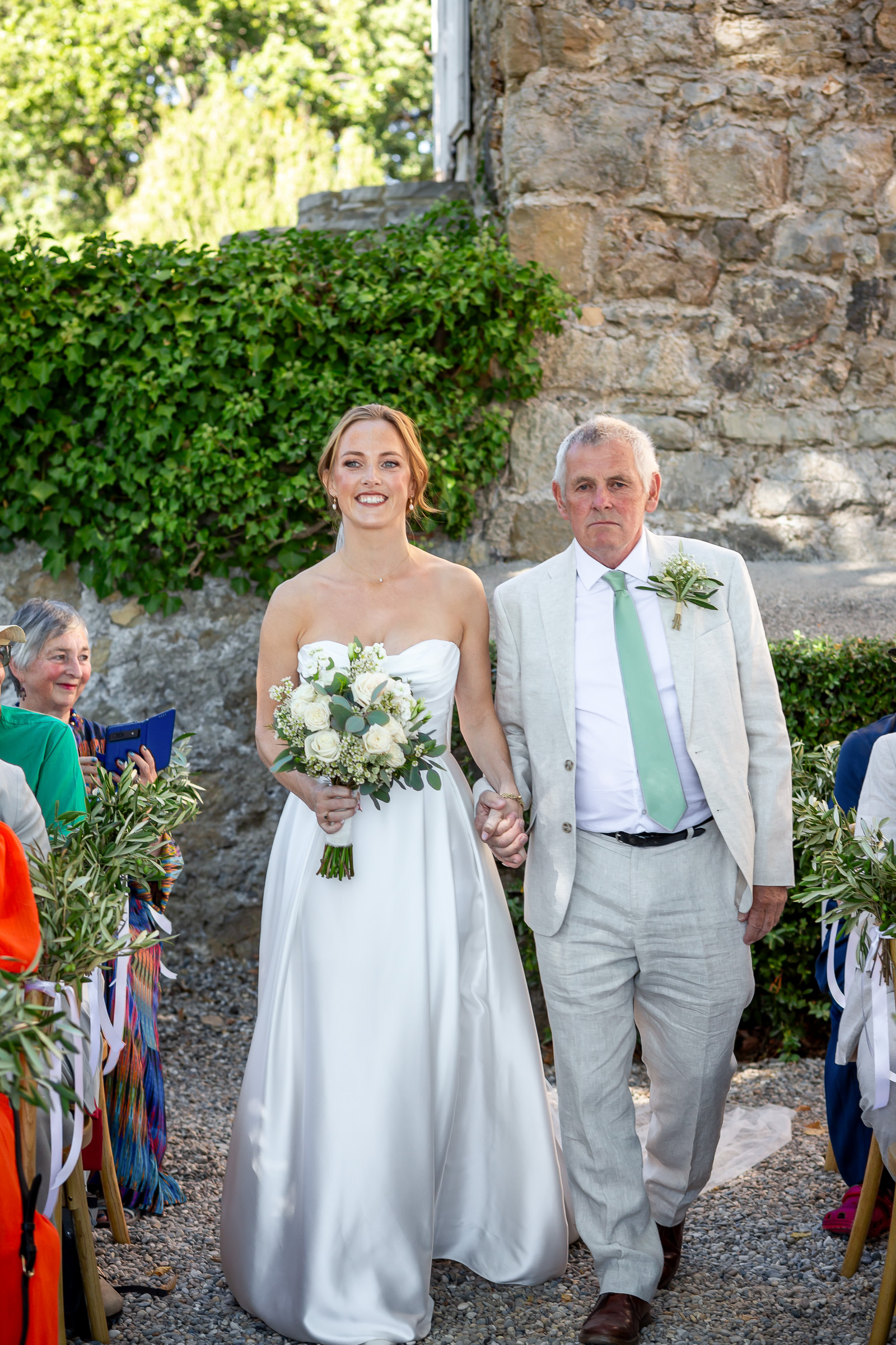 Emma walking into the wedding ceremony with her father Bob