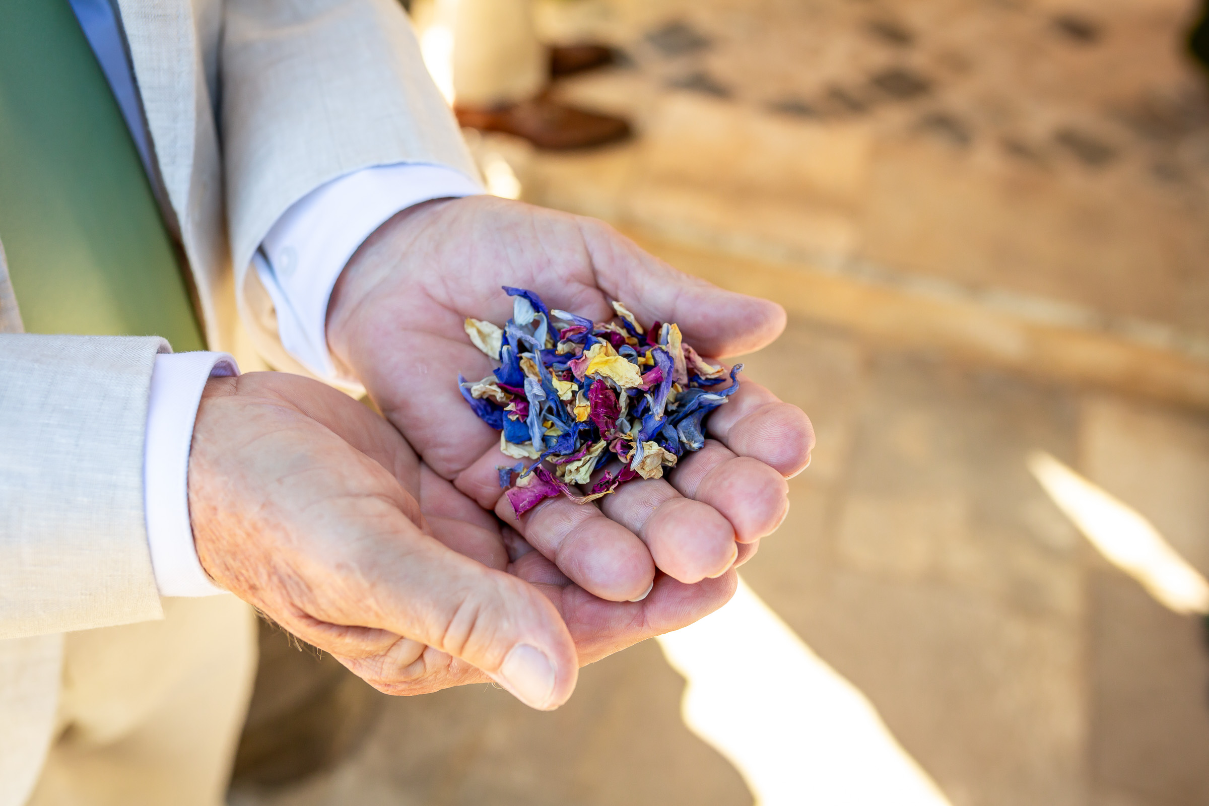 Dried rose-petal wedding confetti prepared by Emma’s parents