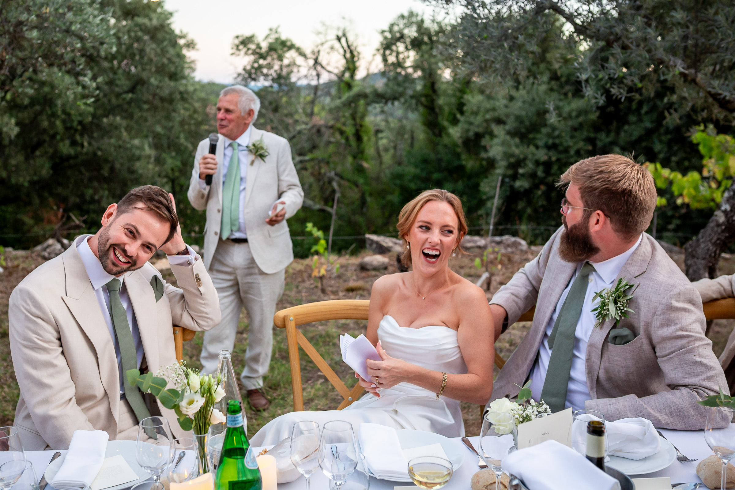 Emma and Rowan laughing at their wedding breakfast