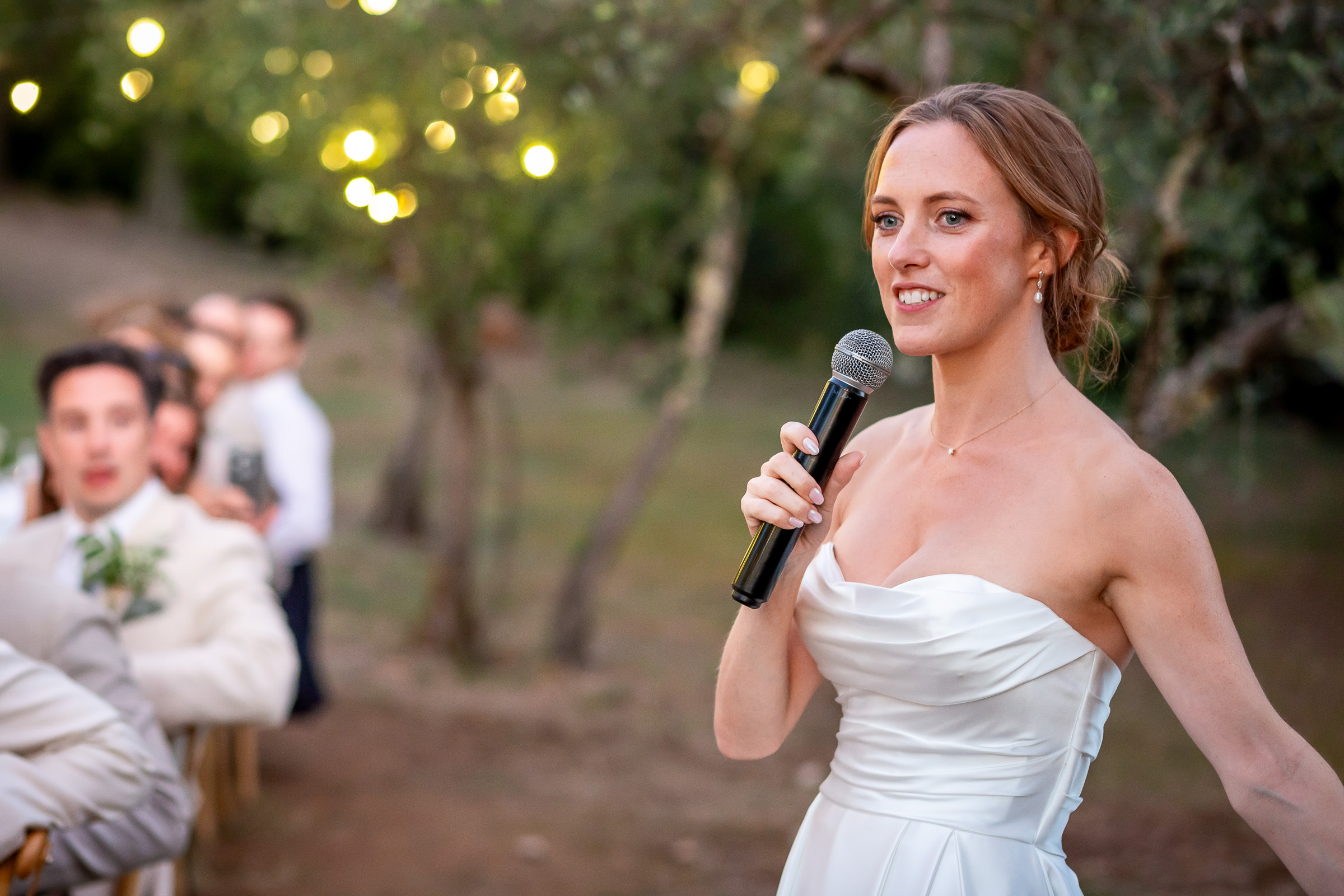 Emma giving her wedding speech in the olive grove