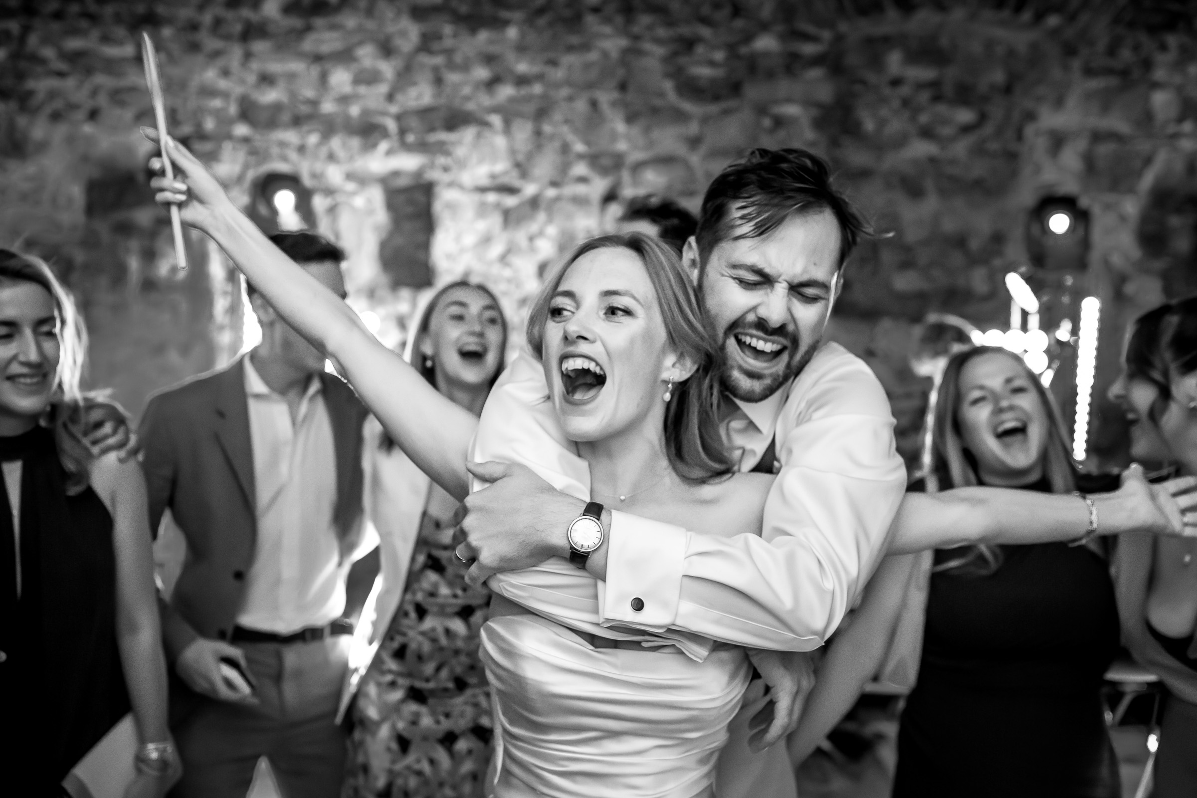 Emma and Rowan celebrating together on the dance floor